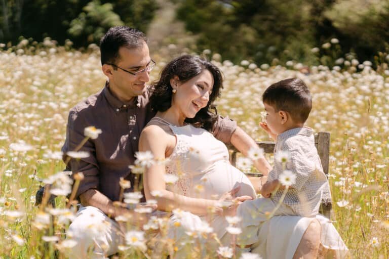 TINA, POUYA, AND NEIL’S MATERNITY SESSION IN A DAISY FIELD