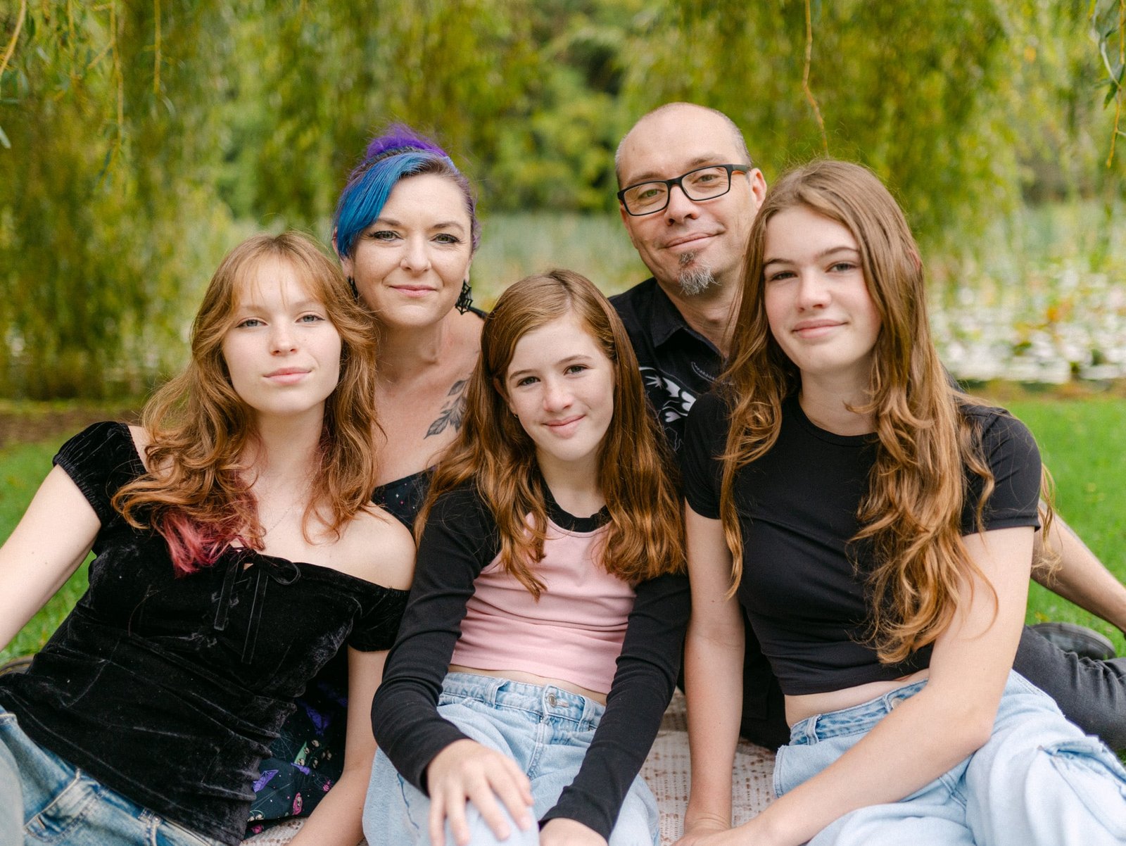 Helen and all the family looking at camera for a nice group shot during a family session at lake Te Koo Utu